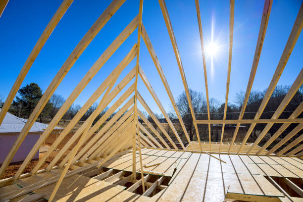 istock Support beams beams roof construction at new house construction using a wood frame truss 1636200375