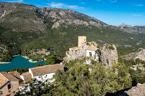 Scenery. Mountainous terrain and lake, the ancient fortress of Guadalest province of Alicante. Upper angle.