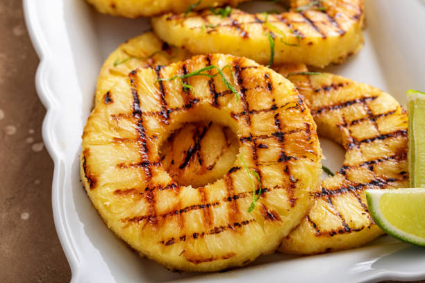 istock Grilled pineapple with lime honey glaze and whipped cream 1636264239