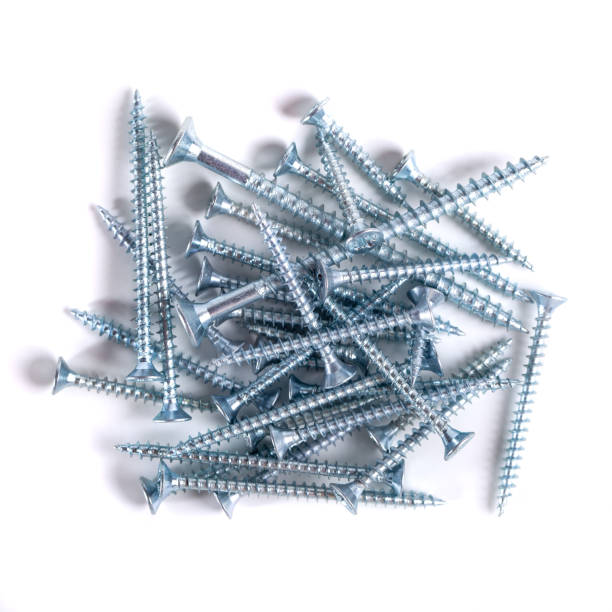istock Chrome screw on white background. Tapping screws from steel close-up 1636269714