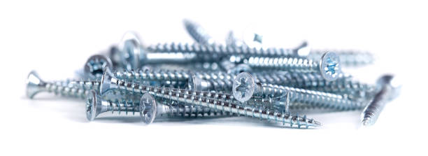 istock Chrome screw on white background. Tapping screws from steel close-up 1636269727