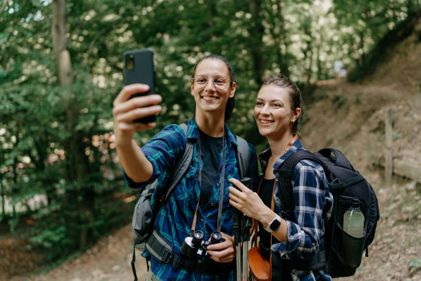 istock Two young women capture a moment with a selfie while hiking 1636286192