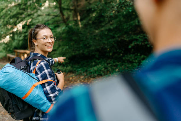 istock Two young women work together to prepare a tent 1636287795