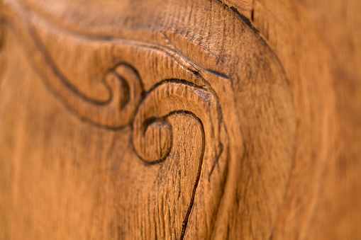 Close up of carvings in a wooden furniture