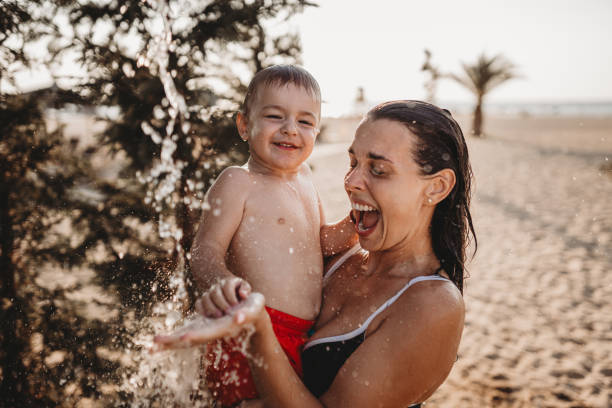 istock Having fun under the outdoor shower 1636337756