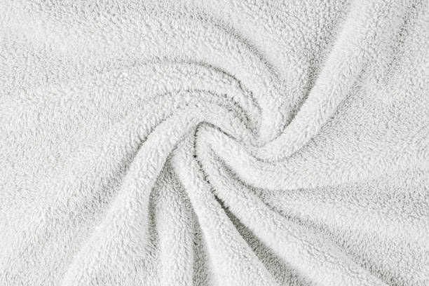 istock Terry cloth, white towel texture background. Soft fluffy textile bath or beach towel material 1636341681