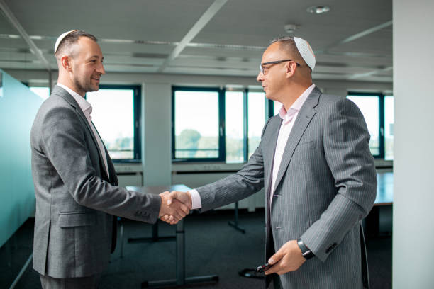 istock Two jewish Businessmen market agents at work 1636359613