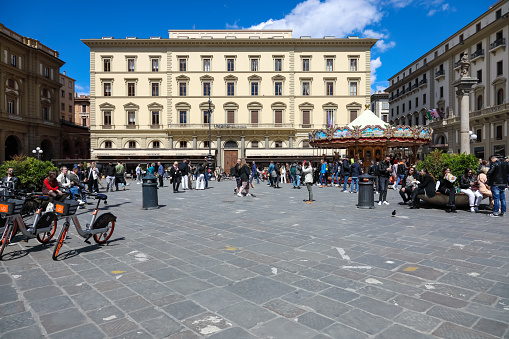 Florence, Italy - April 16, 2023: The sights of the city, the buildings that surround the Piazza della Repubblica. This city square is frequently visited by tourists and locals as well