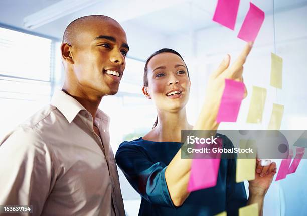 Many Hands Lighten The Load Stock Photo - Download Image Now - Adhesive Note, Adult, African Ethnicity