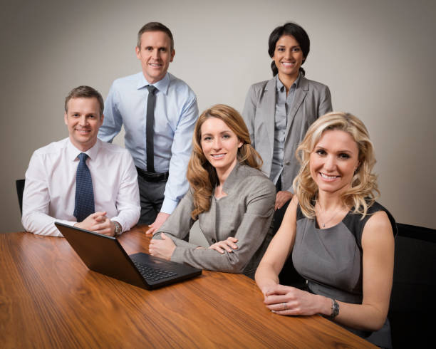 istock Five business people together in a group portrait. 163639192