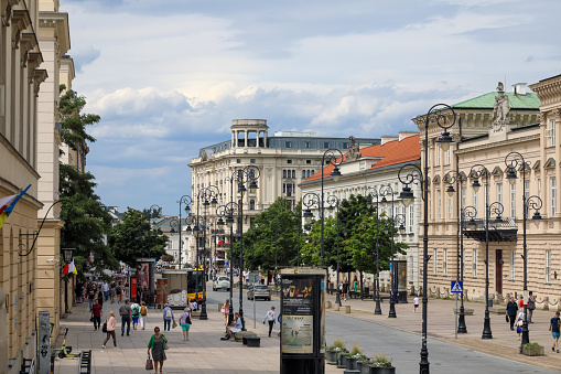 Warsaw, Poland - July 19, 2023: Along the street called Krakowskie Przedmiecie there are various buildings, there is also a luxurious five-star Bristol hotel dating back to 1901
