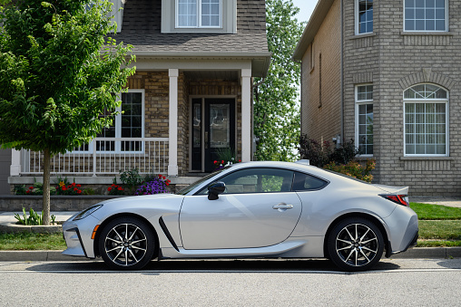 Toronto, Canada - August 19, 2023: A silver Toyota GR86 parked on the side of a residential street.