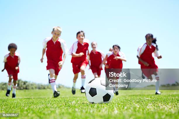 Attacking As A Team Stock Photo - Download Image Now - Kids' Soccer, Sky, Sports Field