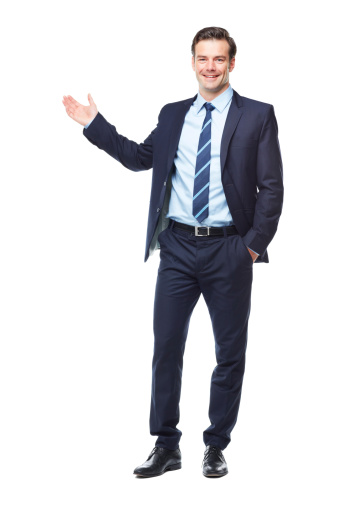 A full length studio shot of a young corporate businessman with his arm raised presenting copyspace