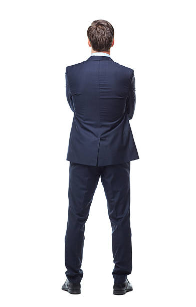 Turning his back on business A full length rear view studio shot of the back of a young businessman rezar stock pictures, royalty-free photos & images