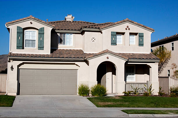 istock Stucco Home Exterior and  Blue Sky 163641404