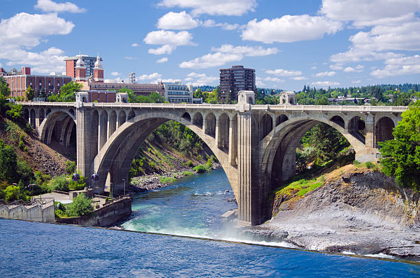 Monroe Street Bridge in Spokane, WA View of the Monroe Street Bridge in Spokane, WA. The bridge was the third longest concrete bridge in the world when it was completed in 1911 and was renovated in 2003. washington state stock pictures, royalty-free photos & images