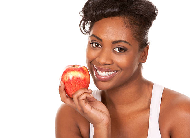 istock woman with an apple 163642187