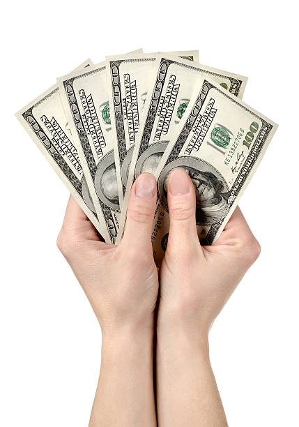 istock Hands holds hundreds of dollars 163642243