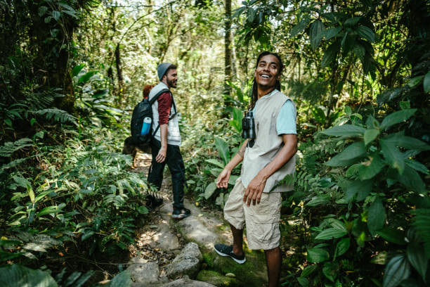 istock Happy friends during a hiking in the forest 1636433321