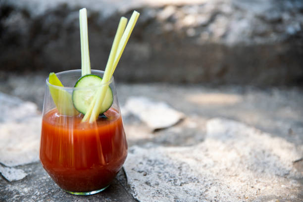 istock Bloody Mary Cocktail on stone background 1636437701
