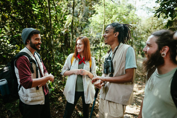 istock Friends talking during a hiking on the forest 1636438655