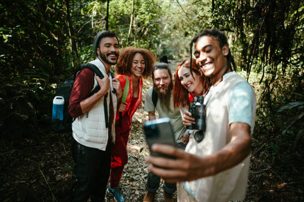 istock Friends taking a selfie using mobile phone during hiking in the forest 1636443961