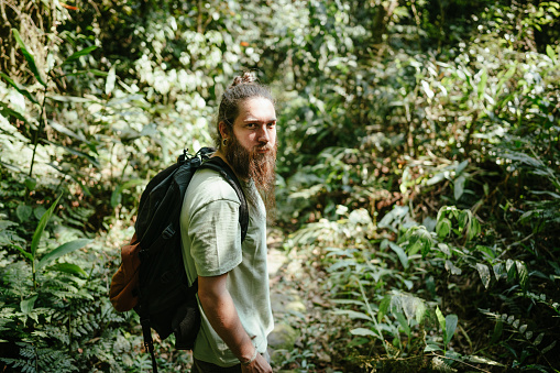Portrait of a mid adult man hiking in the forest