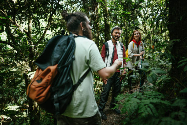 istock Friends talking while hiking in the forest 1636447226