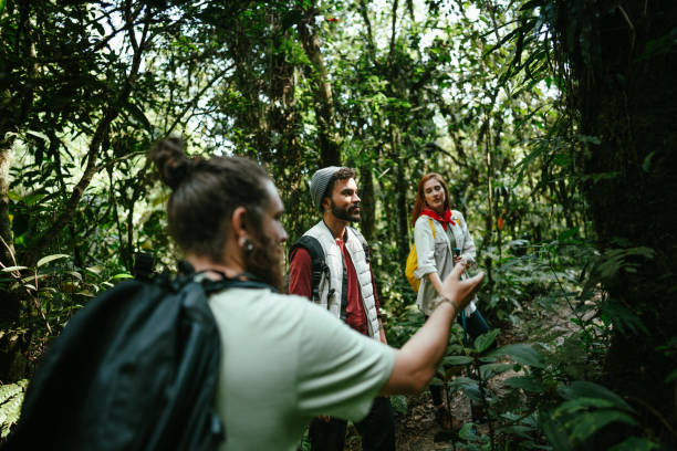 istock Friends talking while hiking in the forest 1636447240