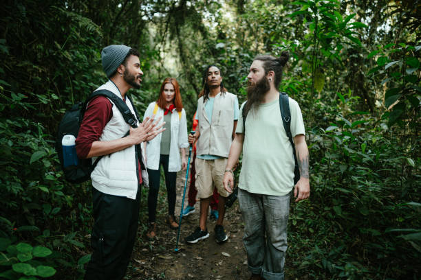 istock Friends talking while hiking in the forest 1636447765