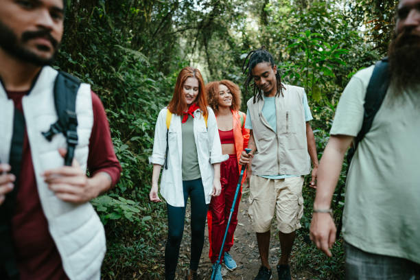 istock Friends talking while hiking in the forest 1636448275