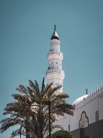 Minaret with date tree in mosque qoba, madina,saudi arabia