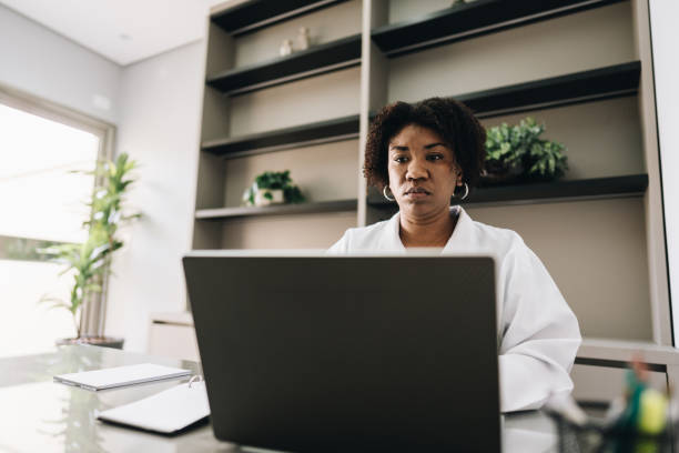 istock Female doctor using laptop on a doctor's office 1636467315