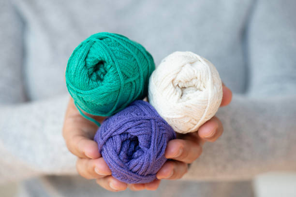 istock Hands Holding A Ball Of Wool 1636474248