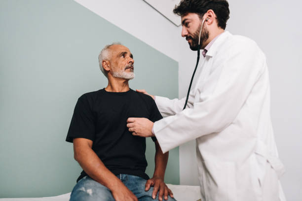 istock Doctor examining his patient on a doctor's office 1636474823