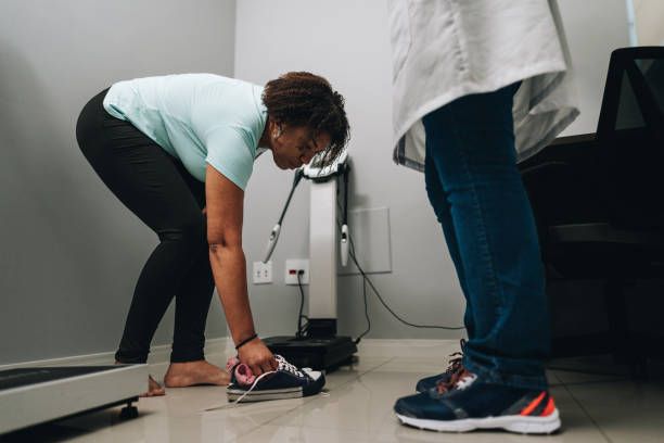 istock Patient taking off sneakers on a doctor's office 1636479715