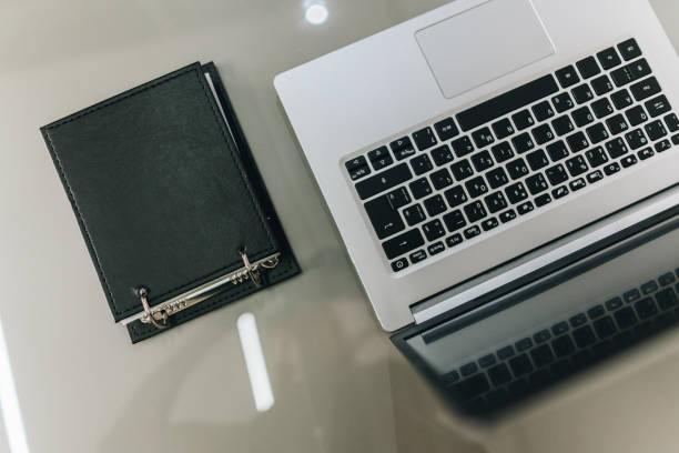 istock Close-up of a laptop and notepad on a doctor's office 1636489320