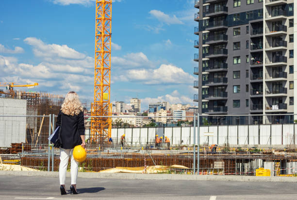 istock Woman construction manager going to check works on the construction site 1636497530