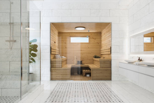 Wooden Sauna In Luxury Modern Bathroom Wooden sauna in a modern luxurious bathroom. luxury modern estate mansion bathroom shower stock pictures, royalty-free photos & images