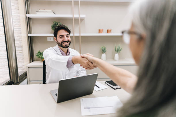 istock Doctor greeting his patient on a doctor's office 1636509677