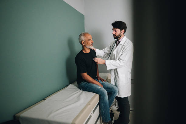 istock Doctor examining a patient on a hospital 1636511699
