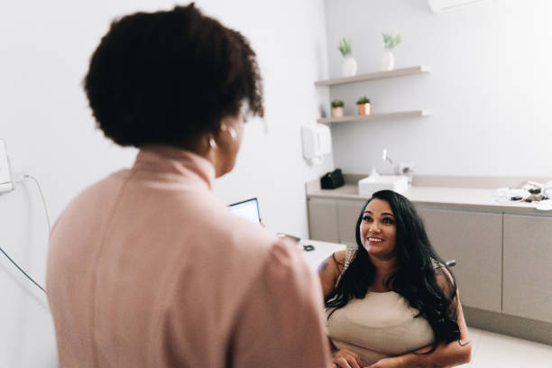istock Patient talking with her doctor on a doctor's office 1636512260