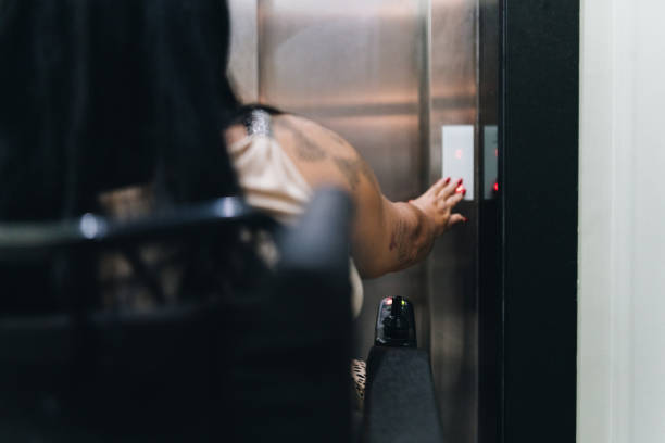 istock Wheelchair mature woman waiting elevator 1636512823