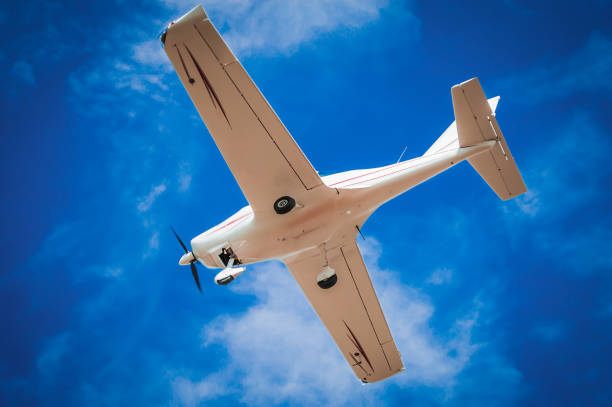 istock White aircraft in the blue sky 1636523593
