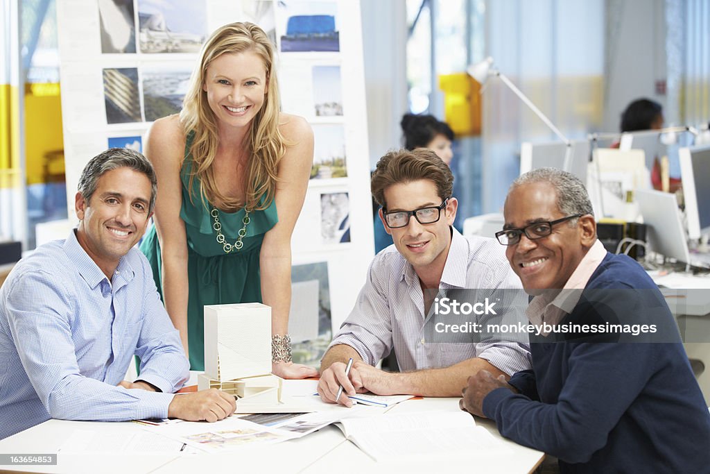 Portrait Of Team In Creative Office Portrait Of Team In Creative Office Smiling To Camera Casual Clothing Stock Photo