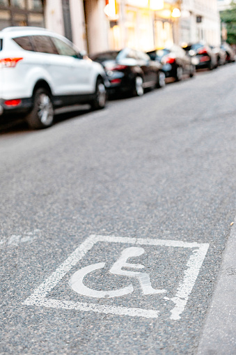 Parking with wheelchair symbol for disabled people.
