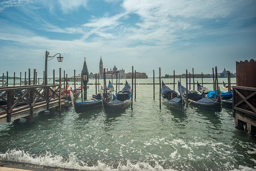 VENEZIA, ITALY - August 18, 2023: gondolas docked at the port, in the boat parks of venice