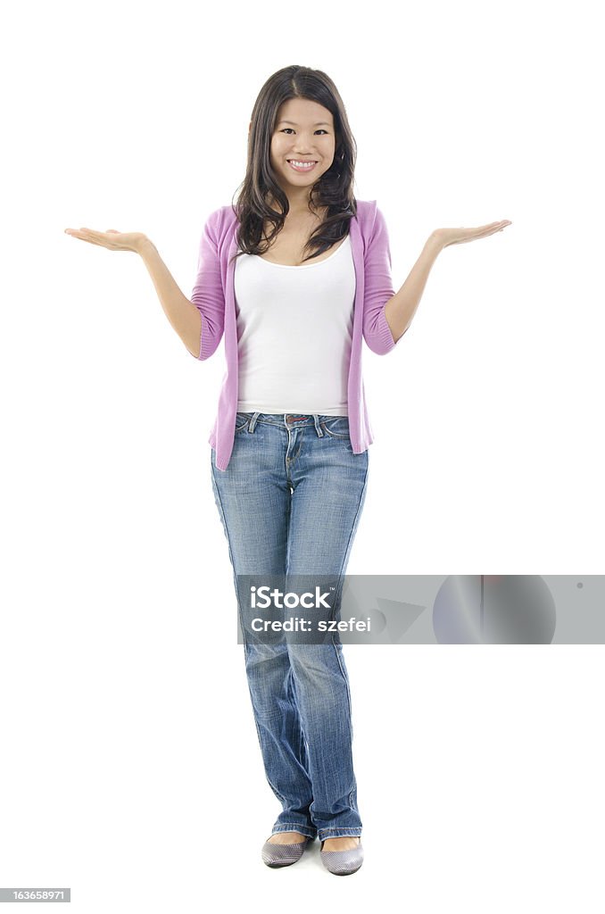 Showing something on the palms Southeast Asian Chinese woman showing something on the palms of her hands, full body standing on white background Adult Stock Photo