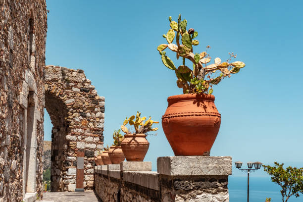 istock view from Castelmola, Sicily on Mediterranean Sea. Ceramic potted plant in front view 1636598116